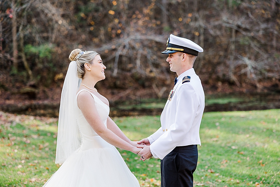 bride and groom holding hands at this strawberry creek wedding