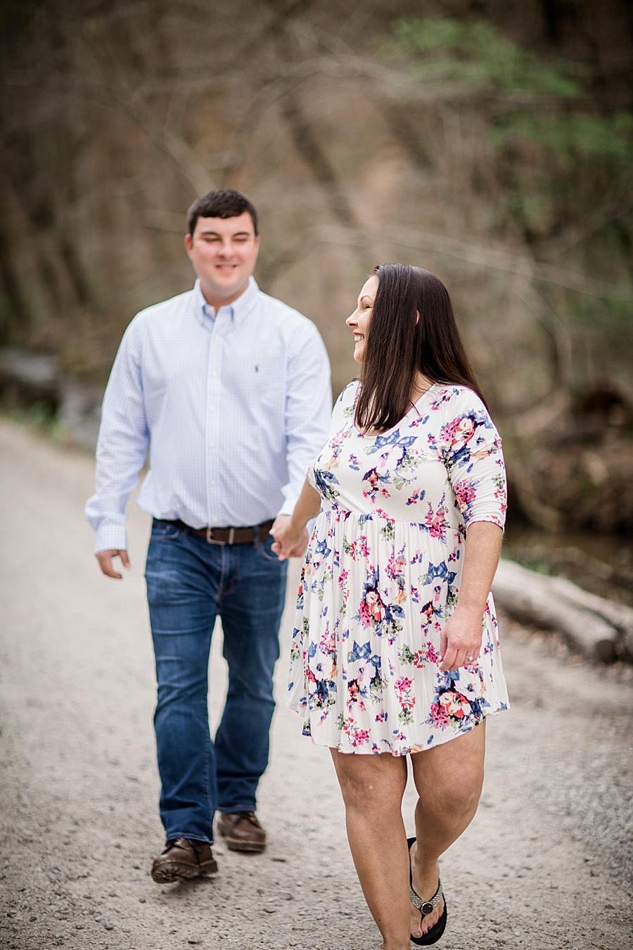 Holding hands at this Norris Dam Engagement Photos by Knoxville Wedding Photographer, Amanda May Photos.