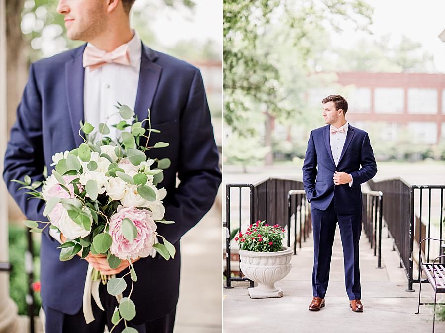 Groom holding bridal bouquet at this The Olmsted Wedding by Knoxville Wedding Photographer, Amanda May Photos.