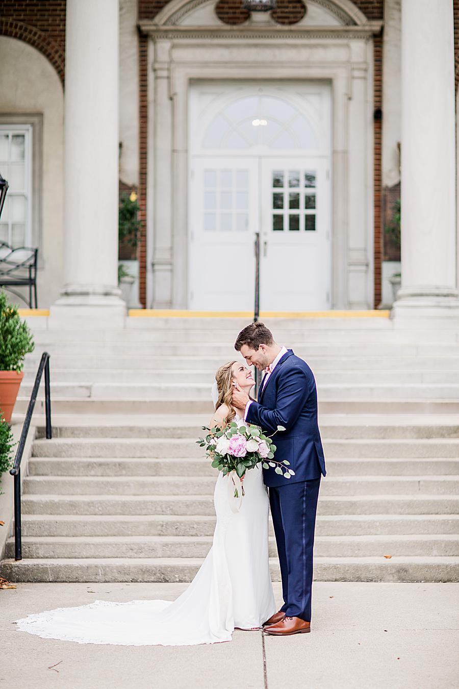 At the base of the church steps at this The Olmsted Wedding by Knoxville Wedding Photographer, Amanda May Photos.