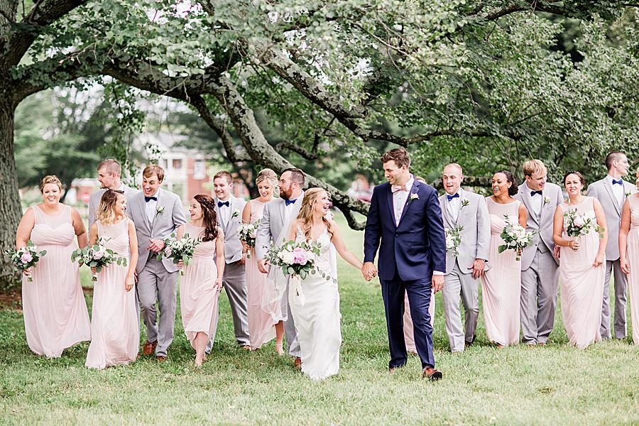 Bridal party walking together by Knoxville Wedding Photographer, Amanda May Photos.