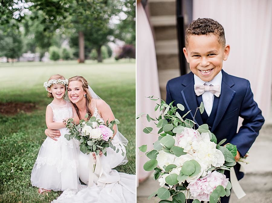 Ring bearer holding bridal bouquet at this The Olmsted Wedding by Knoxville Wedding Photographer, Amanda May Photos.