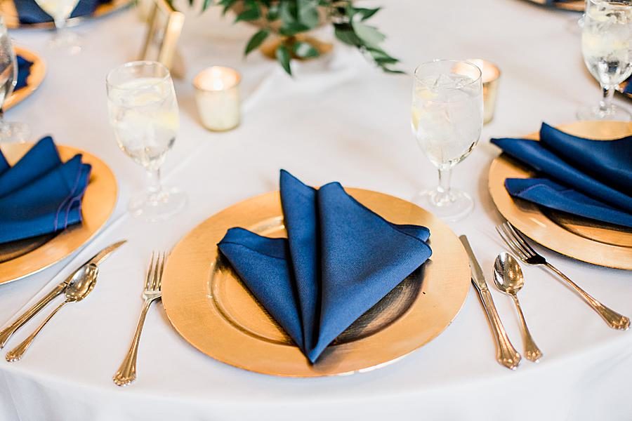 Gold charger and navy blue napkin at this The Olmsted Wedding by Knoxville Wedding Photographer, Amanda May Photos.