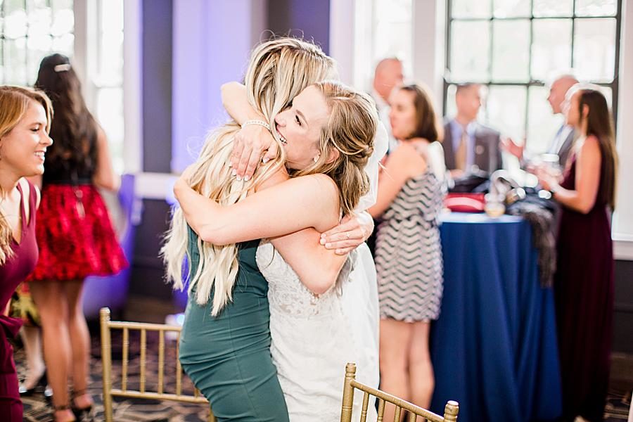 Bride hugging guests by Knoxville Wedding Photographer, Amanda May Photos.