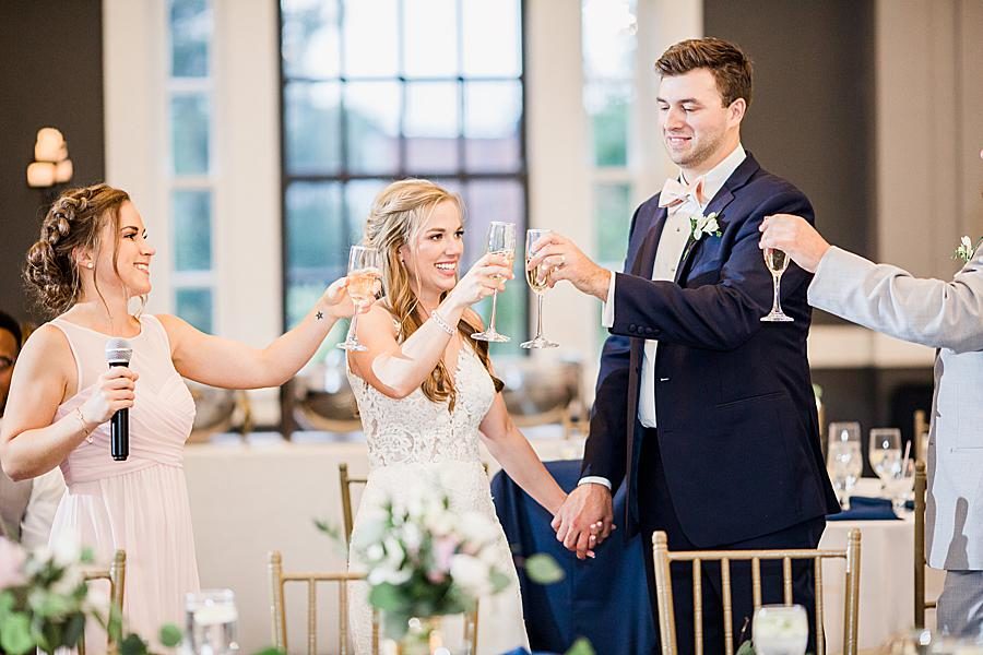 Cheers at this The Olmsted Wedding by Knoxville Wedding Photographer, Amanda May Photos.