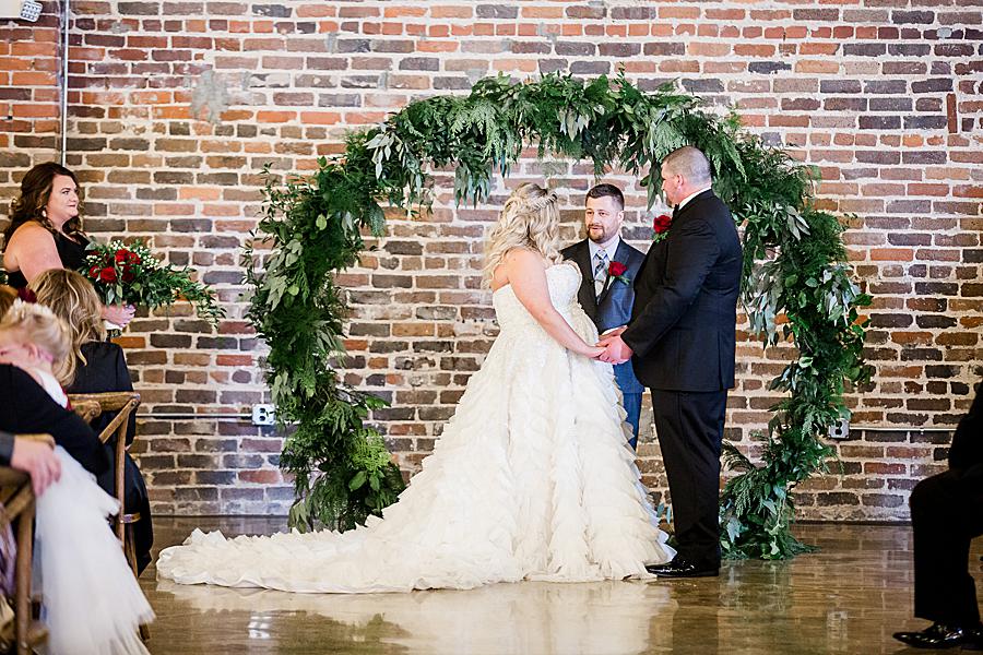 Exchanging vows at this The Press Room Wedding by Knoxville Wedding Photographer, Amanda May Photos.