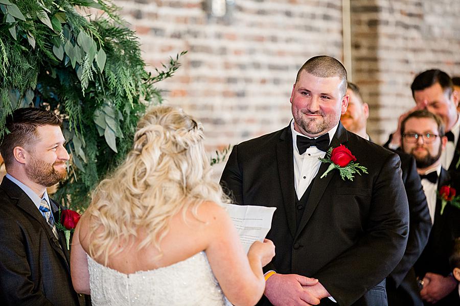 Reading vows at this The Press Room Wedding by Knoxville Wedding Photographer, Amanda May Photos.