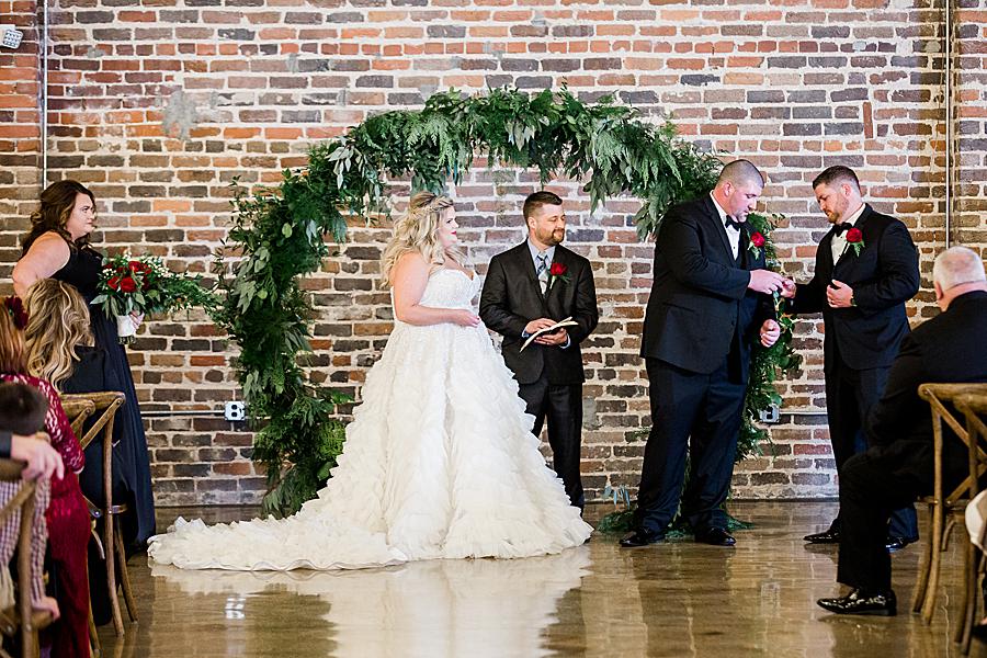Getting the ring at this The Press Room Wedding by Knoxville Wedding Photographer, Amanda May Photos.