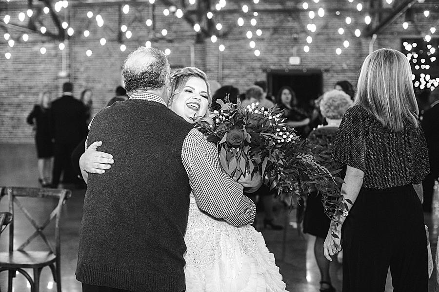 Hugging guests at this The Press Room Wedding by Knoxville Wedding Photographer, Amanda May Photos.