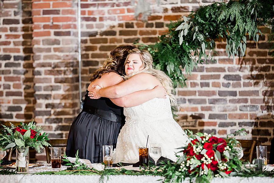Hugging bridesmaids by Knoxville Wedding Photographer, Amanda May Photos.