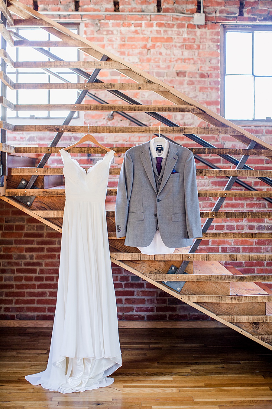 Wedding dress and tuxedo jacket handing at this Wedding at The Standard by Knoxville Wedding Photographer, Amanda May Photos.