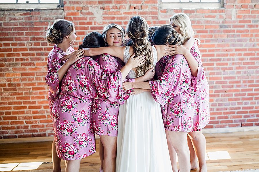 Bride hugging bridesmaids at this Wedding at The Standard by Knoxville Wedding Photographer, Amanda May Photos.