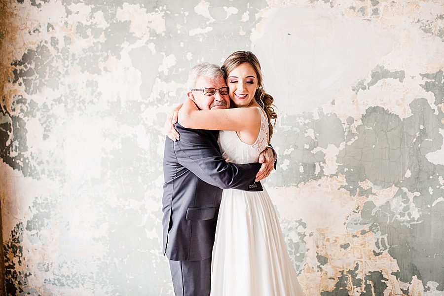 Bride hugging dad at this Wedding at The Standard by Knoxville Wedding Photographer, Amanda May Photos.