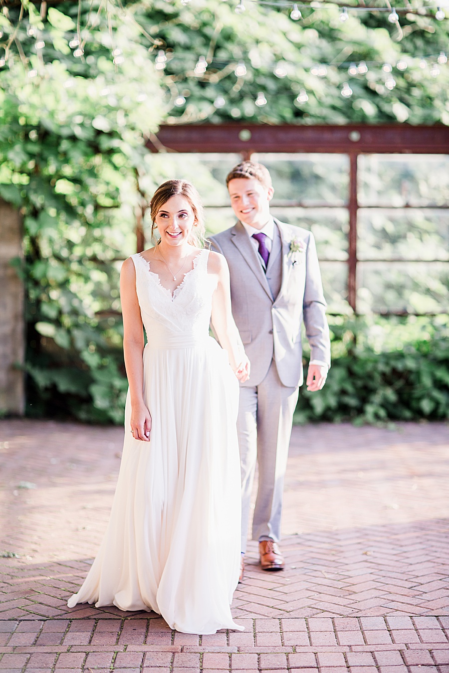 Bride leading groom by Knoxville Photographer, Amanda May Photos.