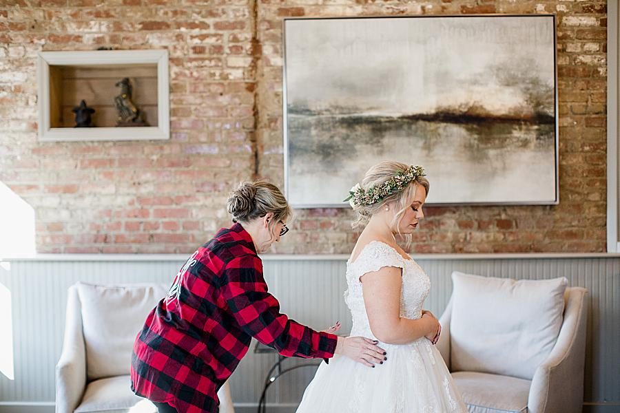 Final touches at this The Foundry Wedding by Knoxville Wedding Photographer, Amanda May Photos.