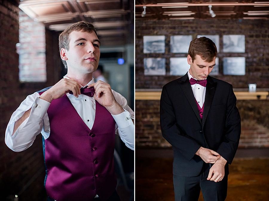 Tying the bow tie at this The Foundry Wedding by Knoxville Wedding Photographer, Amanda May Photos.