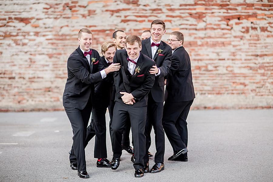 Messing with the groom at this The Foundry Wedding by Knoxville Wedding Photographer, Amanda May Photos.