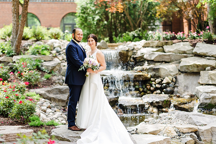couple in front of waterfall at the inn at st. john's