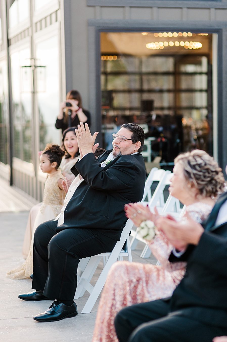 guests clapping for newlyweds