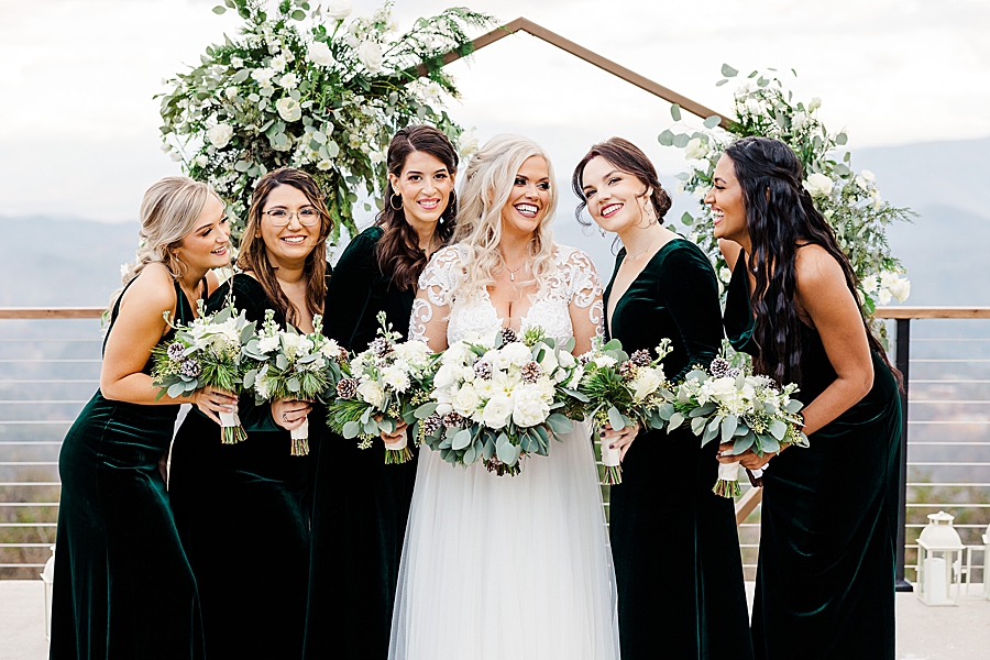 bridal party in green velvet dresses
