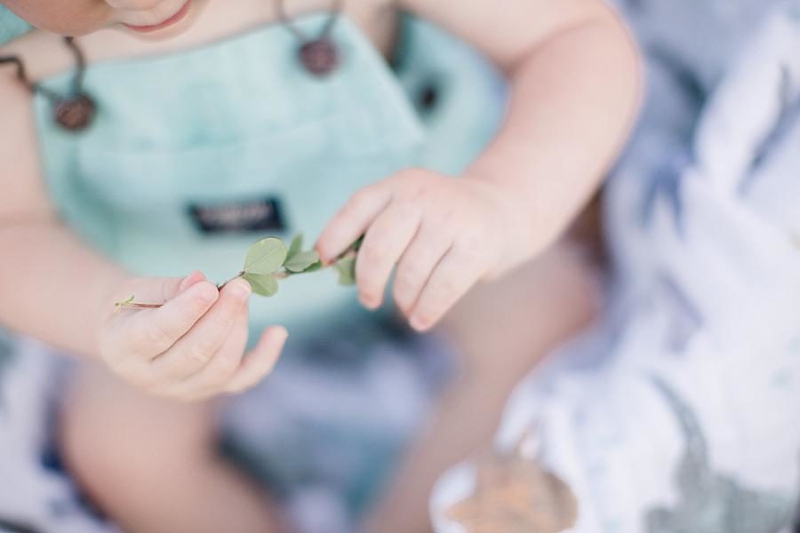 Holding leaves at this Meads Quarry 9 month photos session by Knoxville Wedding Photographer, Amanda May Photos.