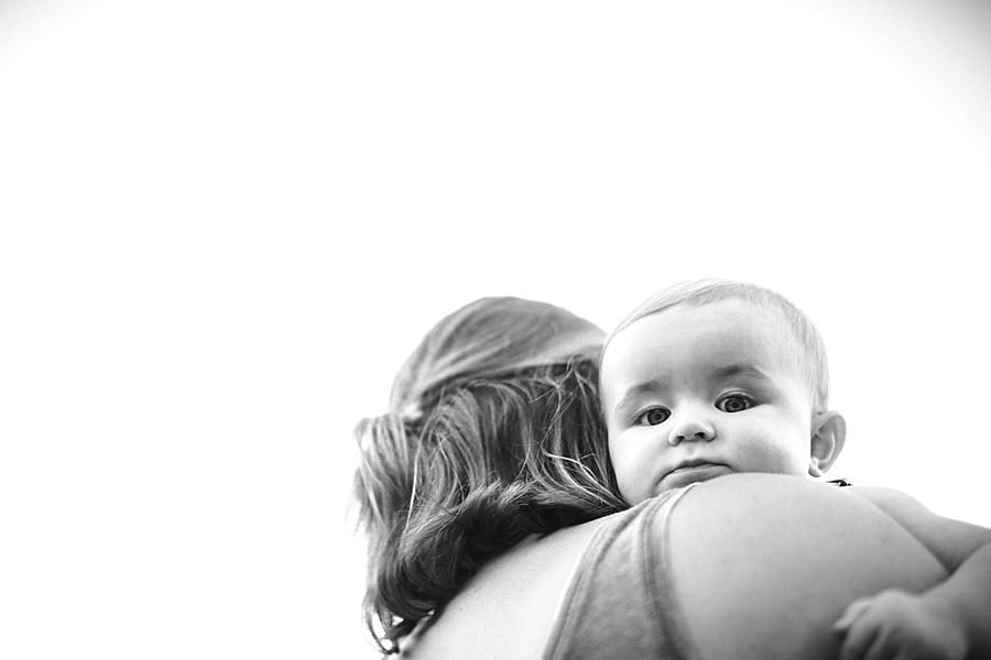 Head on mom's shoulder at this Meads Quarry 9 month photos session by Knoxville Wedding Photographer, Amanda May Photos.