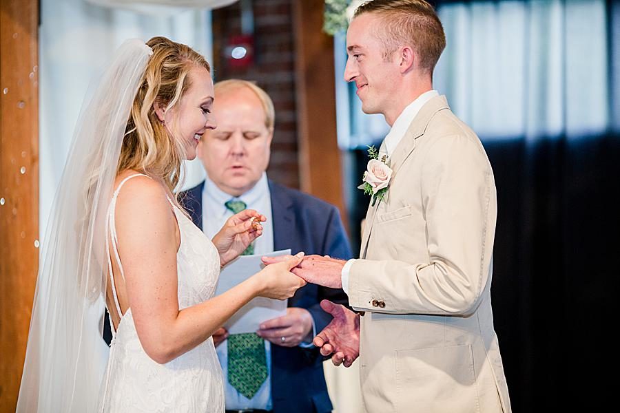 Exchanging rings at this Dayton wedding by Knoxville Wedding Photographer, Amanda May Photos.