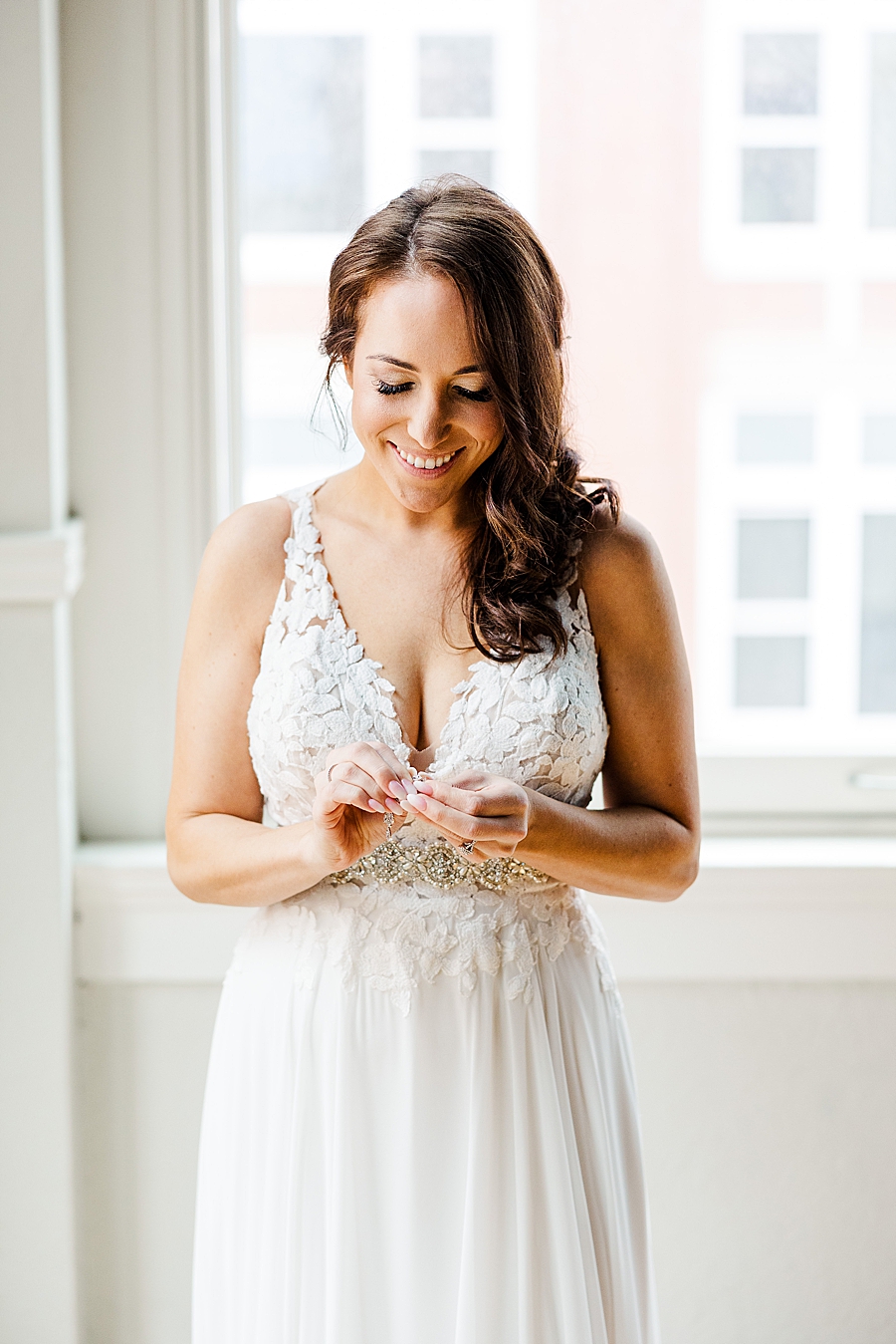bride getting ready at this urban elopement