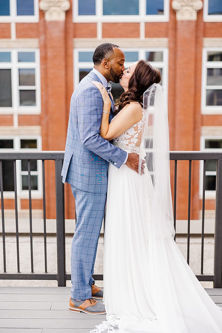kissing during the first look at this urban elopement
