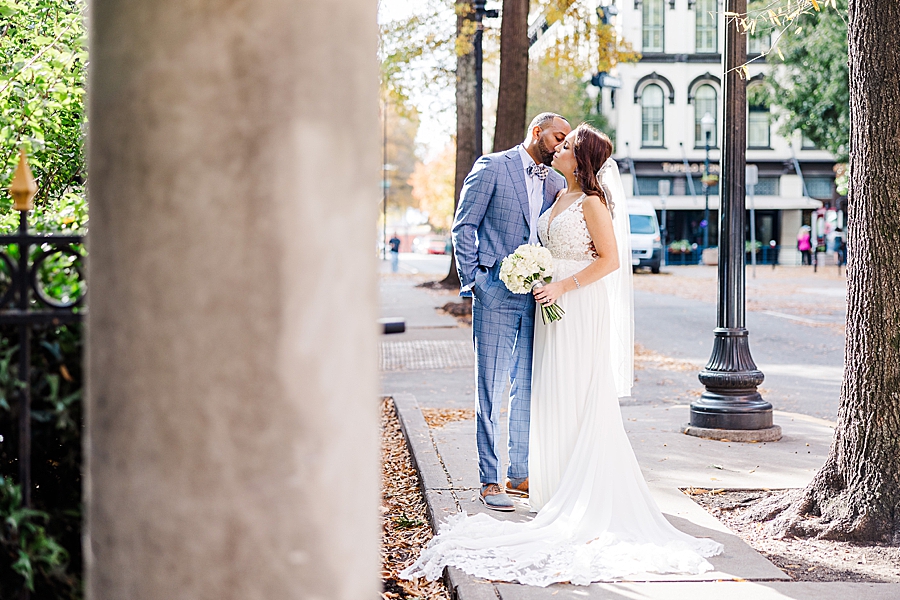 kiss on the cheek at this urban elopement