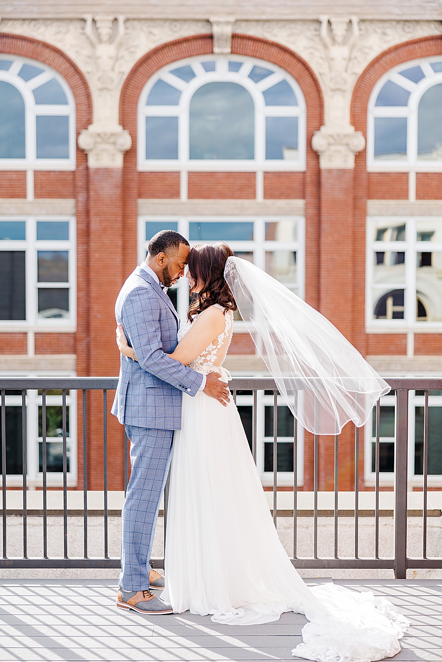 veil flowing at this urban elopement