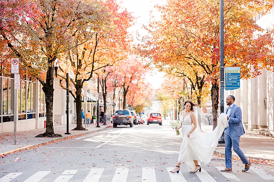 walking across the street at this urban elopement