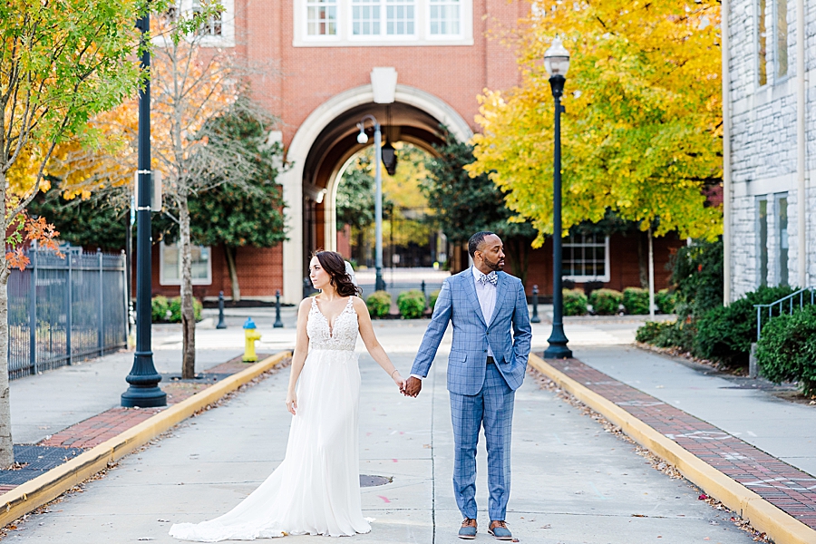 holding hands at this urban elopement
