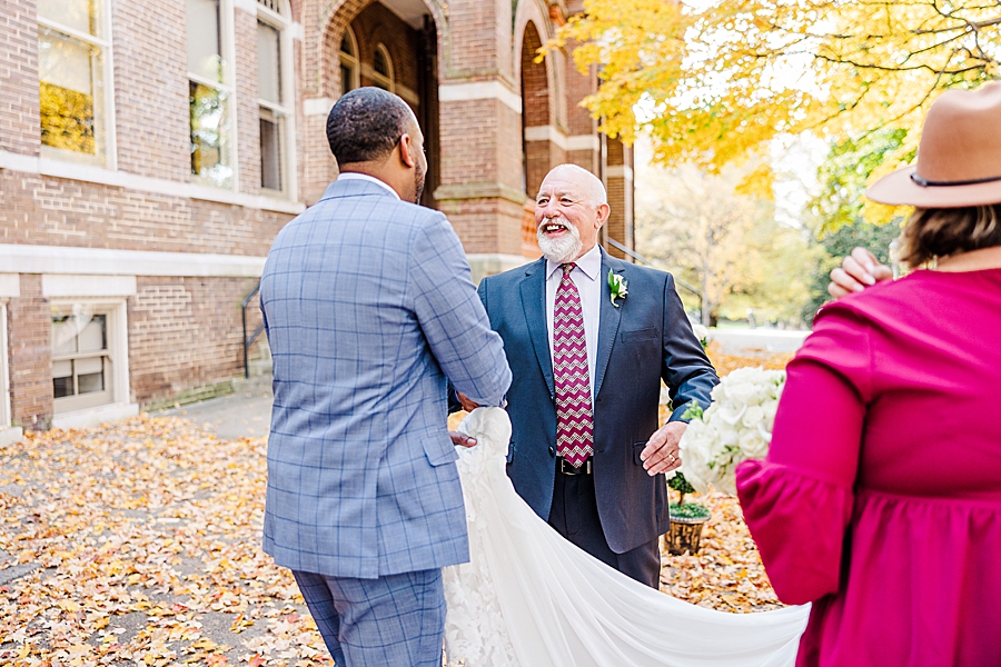 shaking hands at this urban elopement
