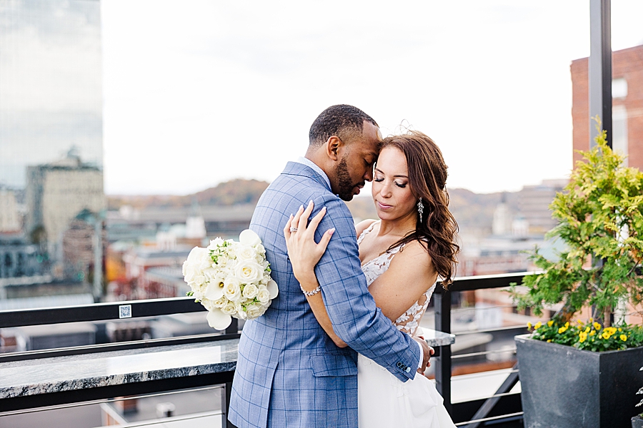 nuzzling on a rooftop at this urban elopement