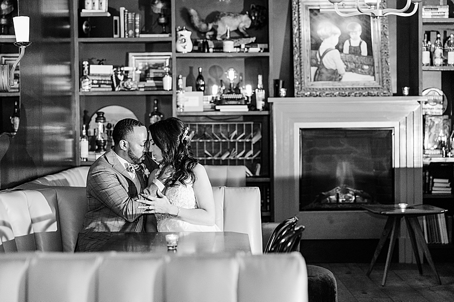 snuggling in a booth at this urban elopement