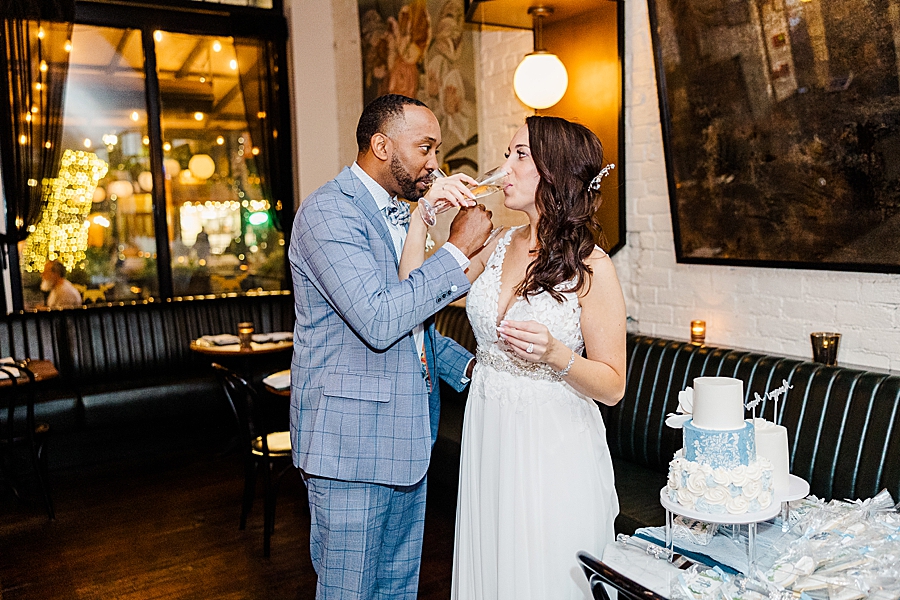 drinking champagne at this urban elopement