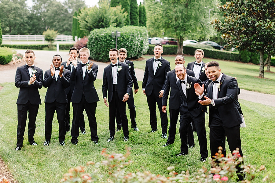 groomsmen clapping at vineyard wedding at castleton