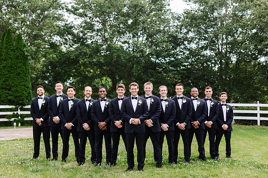 groomsmen posing at vineyard wedding at castleton