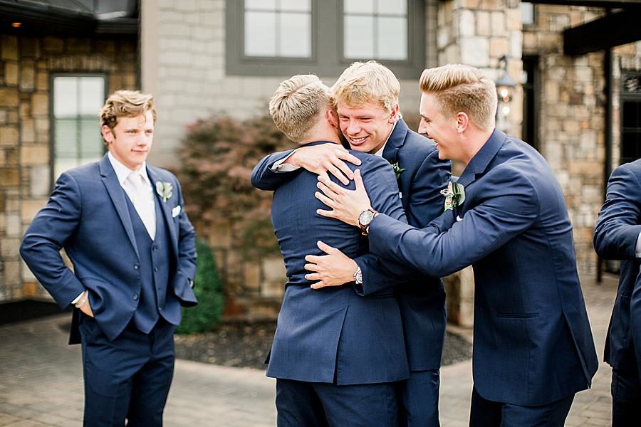 Hugging groomsmen