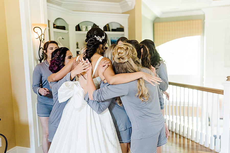 bride hugging bridesmaids at this windriver wedding