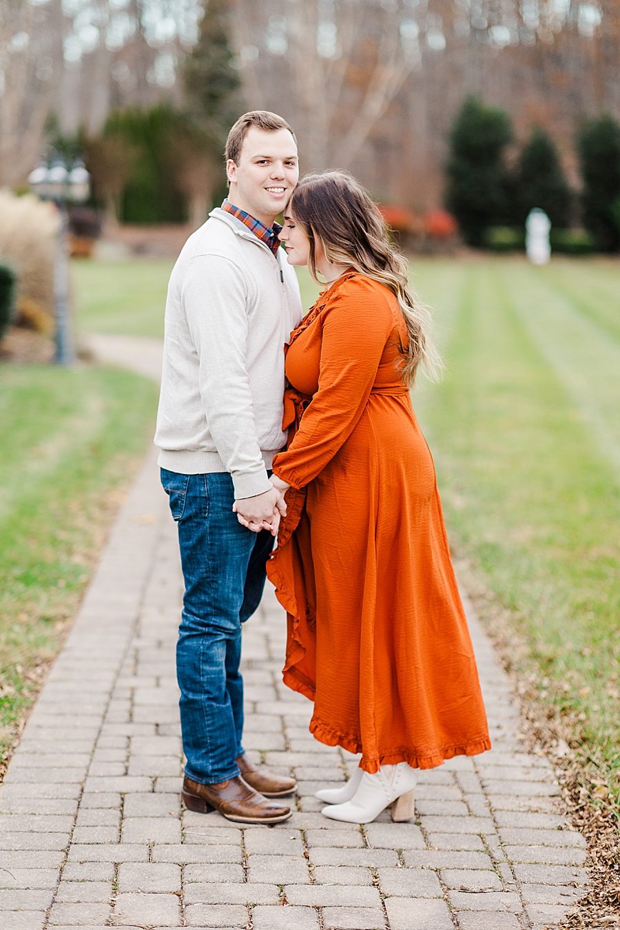 couple on brick path at winter engagement