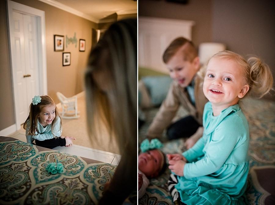 Sitting on the bed smiling at this lifestyle family session by Knoxville Wedding Photographer, Amanda May Photos.