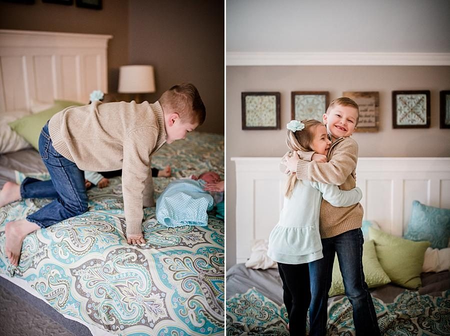 Standing on the bed hugging at this lifestyle family session by Knoxville Wedding Photographer, Amanda May Photos.