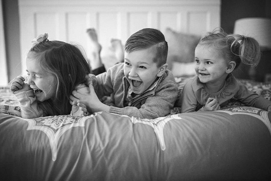 Tickling each other at this lifestyle family session by Knoxville Wedding Photographer, Amanda May Photos.