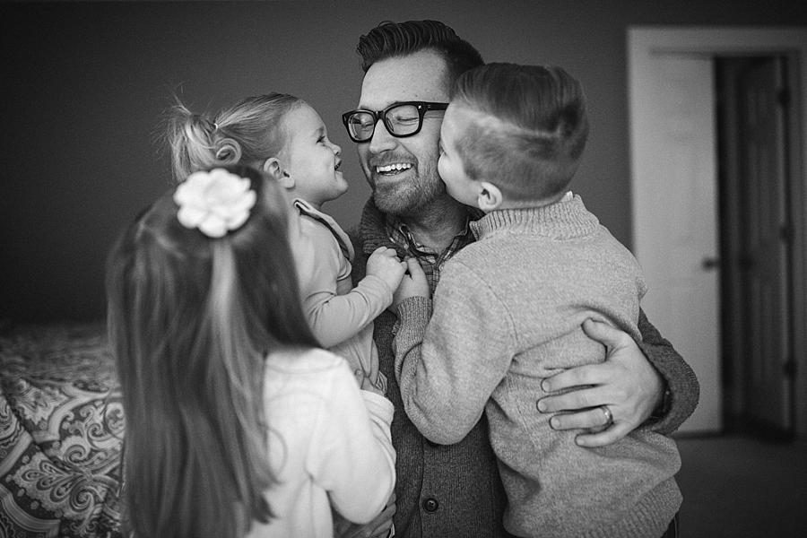 Kissing daddy at this lifestyle family session by Knoxville Wedding Photographer, Amanda May Photos.