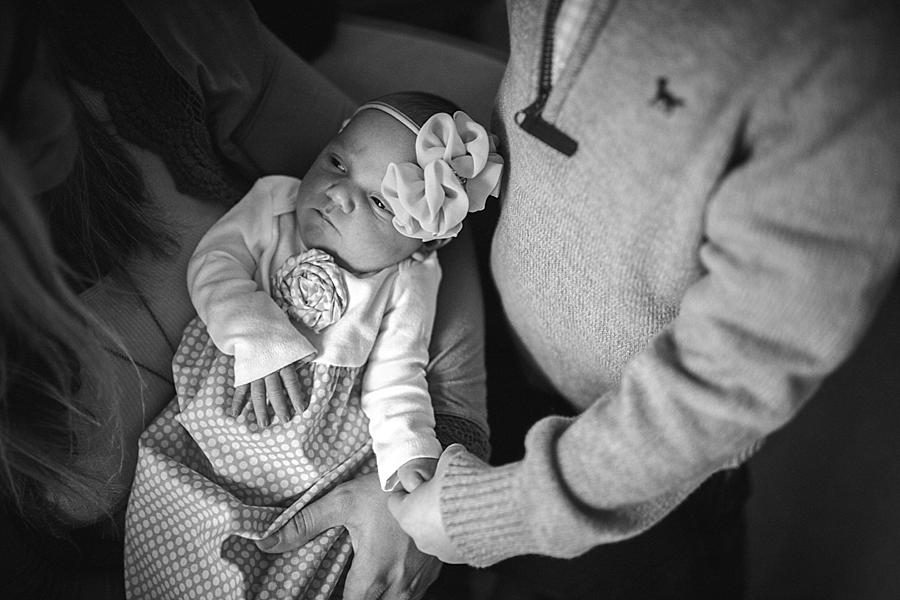 Big brother holding baby's hand at this lifestyle family session by Knoxville Wedding Photographer, Amanda May Photos.