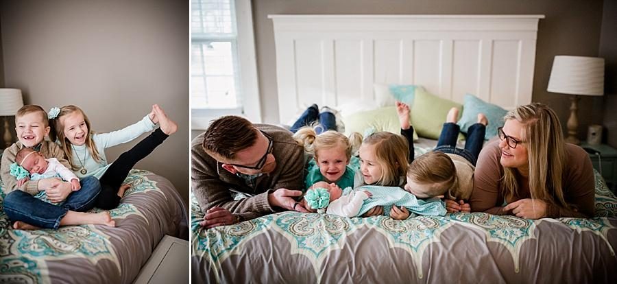 All on their tummies on the bed at this lifestyle family session by Knoxville Wedding Photographer, Amanda May Photos.