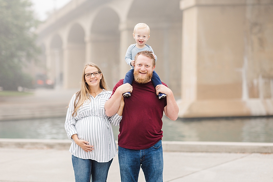 son on dad's shoulders at this world's fair site sunrise maternity session