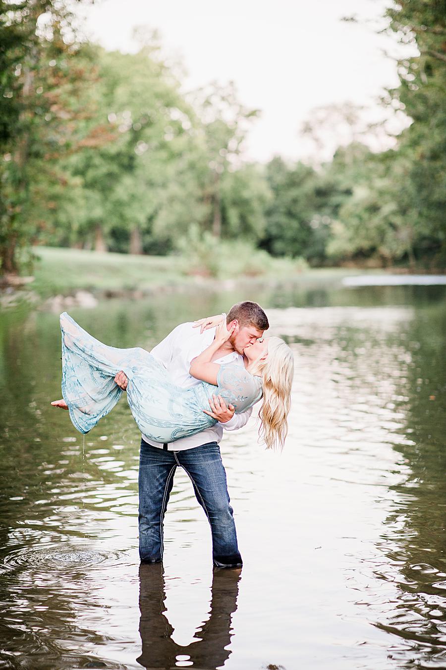 Kissing in the river by Knoxville Wedding Photographer, Amanda May Photos.